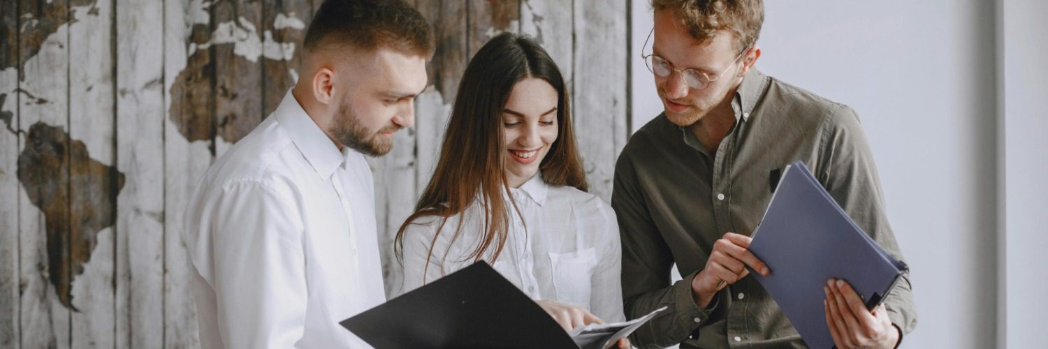 Exporting and International Trade – Workmates reviewing Certificates Of Origin export documentation Exporting and International Trade - Workmates reviewing Certificates Of Origin export documentation